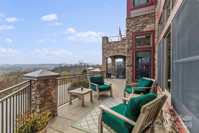 balcony featuring a mountain view