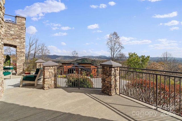 view of gate featuring a mountain view