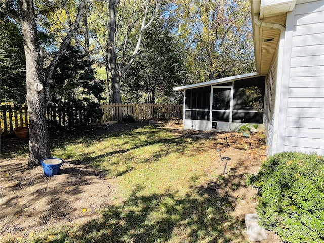 view of yard with a sunroom