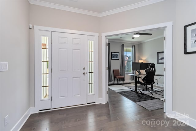 entrance foyer featuring dark wood-type flooring, ceiling fan, and ornamental molding