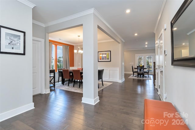 entrance foyer with crown molding, dark hardwood / wood-style floors, and plenty of natural light