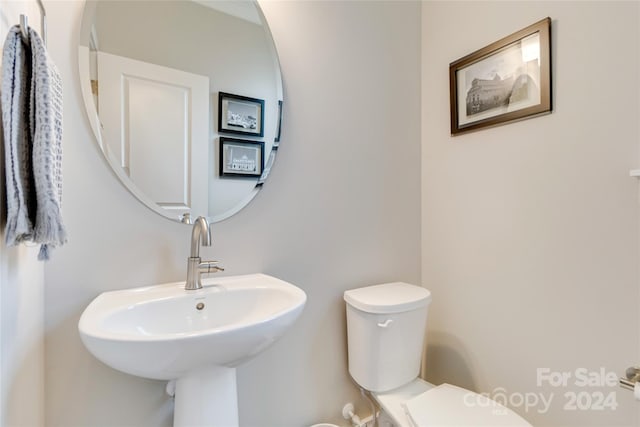 bathroom with toilet and sink