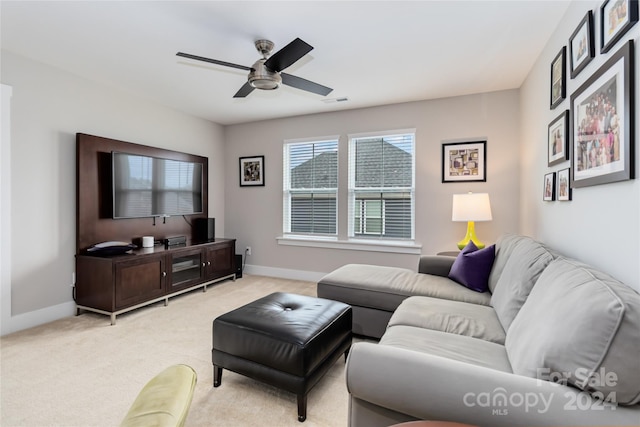 living room featuring ceiling fan and light carpet