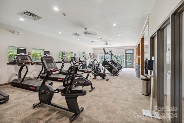 workout area with light colored carpet and ceiling fan