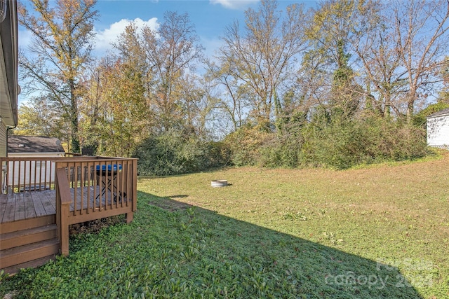 view of yard featuring a wooden deck