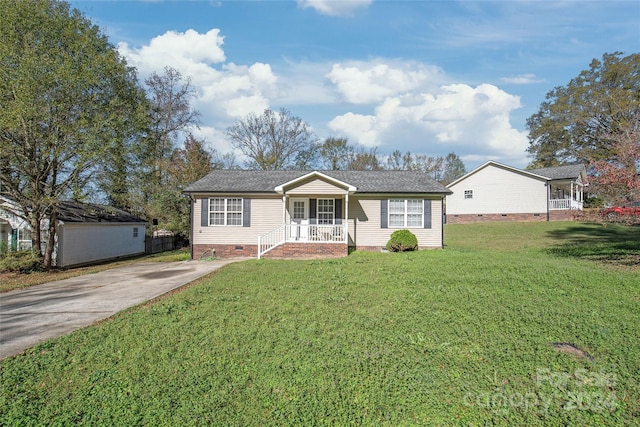 view of front of home with a front yard and a porch