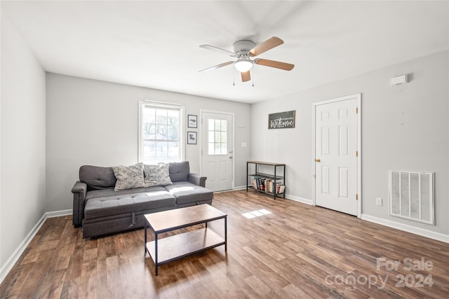 living room with hardwood / wood-style floors and ceiling fan