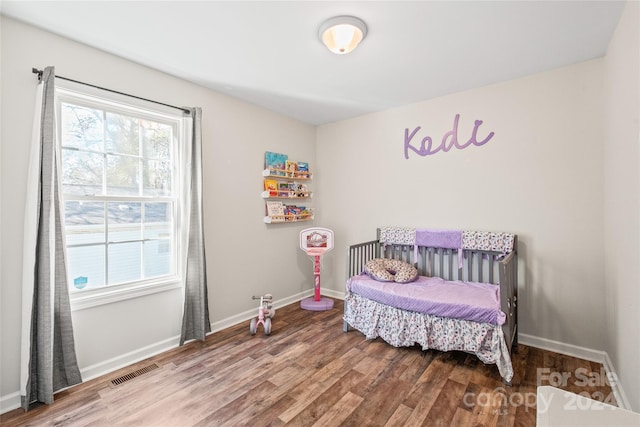 bedroom with wood-type flooring