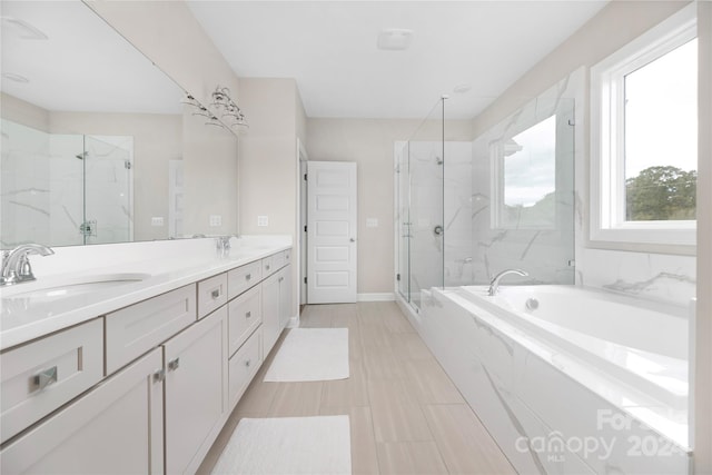 bathroom featuring vanity and plus walk in shower