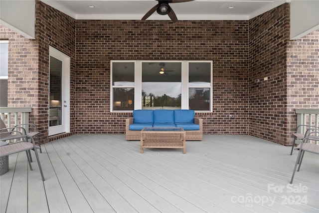 deck featuring outdoor lounge area and ceiling fan