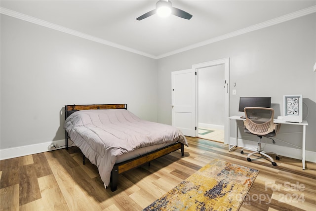 bedroom featuring ceiling fan, light wood-type flooring, and ornamental molding