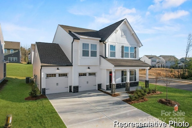 view of front of property featuring a garage, a porch, central AC, and a front yard