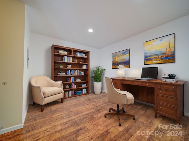 office space with hardwood / wood-style flooring