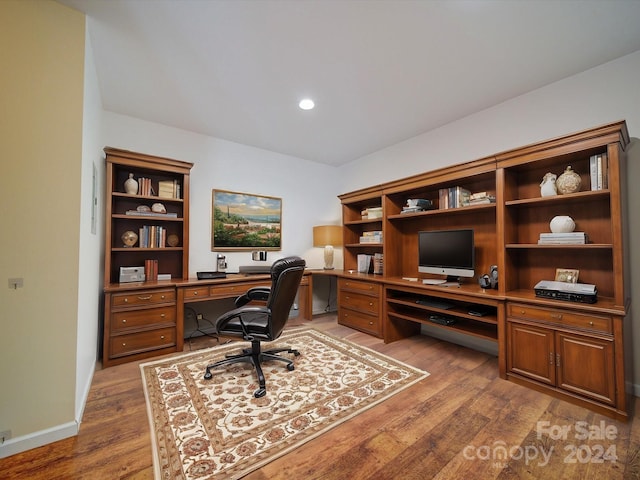 office area with hardwood / wood-style floors