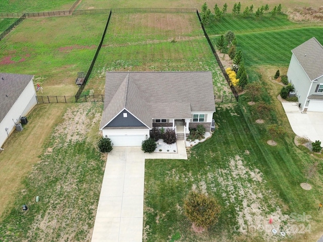 birds eye view of property featuring a rural view