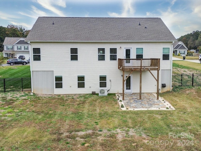 rear view of house featuring a patio, a lawn, and ac unit