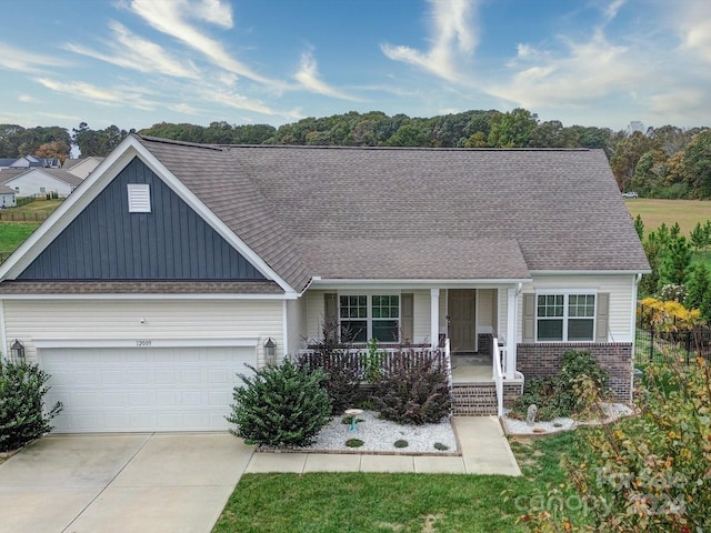 view of front of home featuring a garage and covered porch