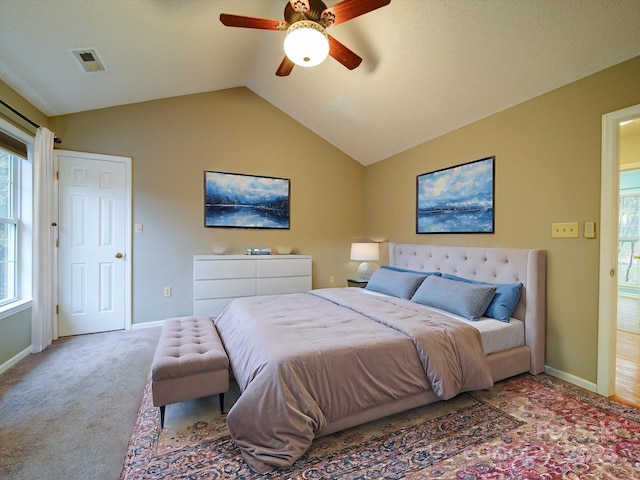 bedroom with carpet flooring, ceiling fan, and lofted ceiling