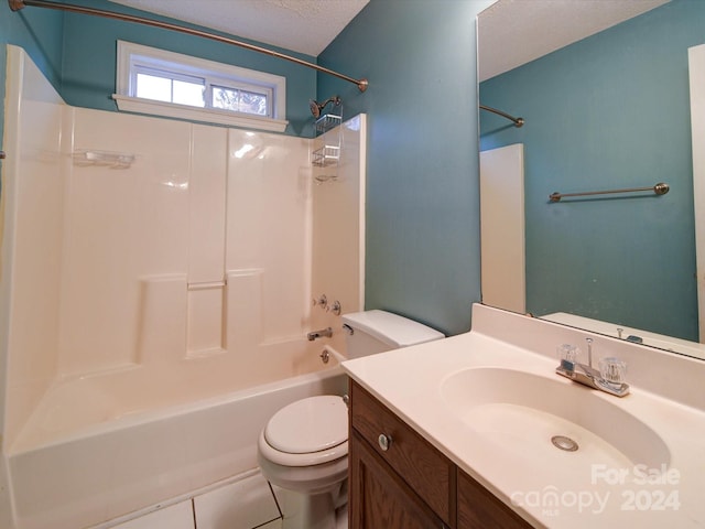 full bathroom featuring tile patterned floors, a textured ceiling, vanity, shower / bathing tub combination, and toilet