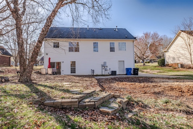 rear view of property with central air condition unit