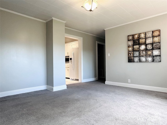 carpeted spare room featuring ornamental molding