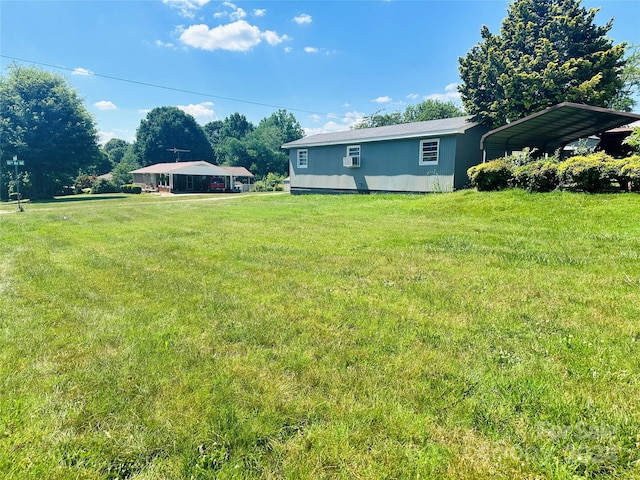 view of yard with a carport