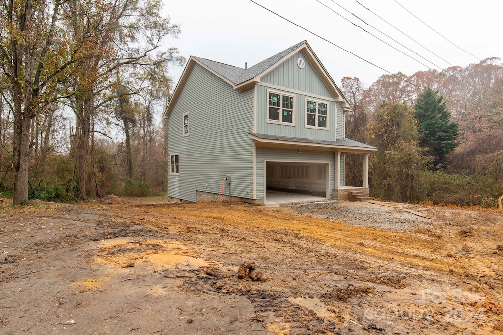 view of side of property featuring a garage