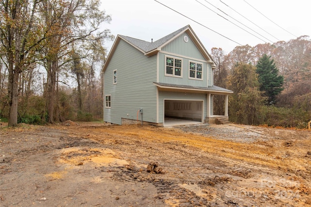 view of side of property featuring a garage