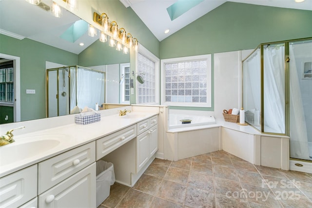 bathroom with lofted ceiling with skylight, vanity, and shower with separate bathtub