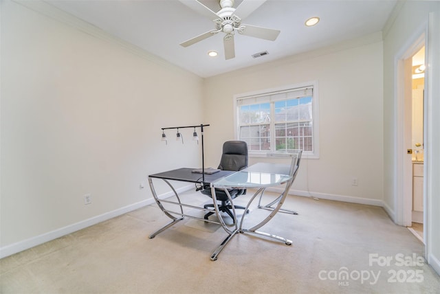 carpeted office with ceiling fan and ornamental molding