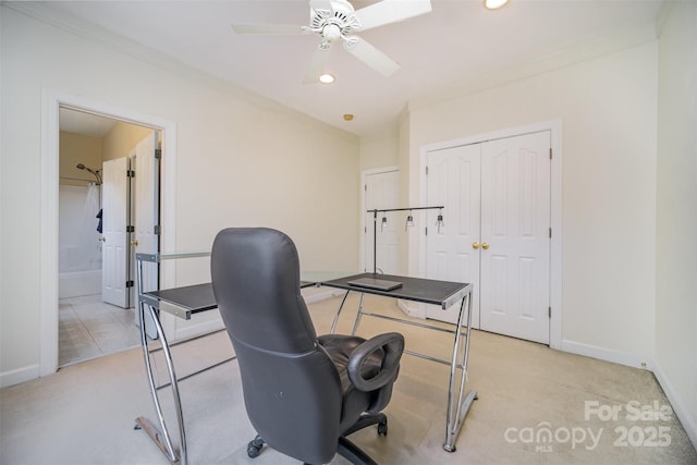 carpeted office with ceiling fan and ornamental molding