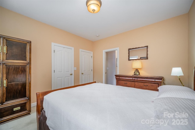 bedroom featuring light carpet