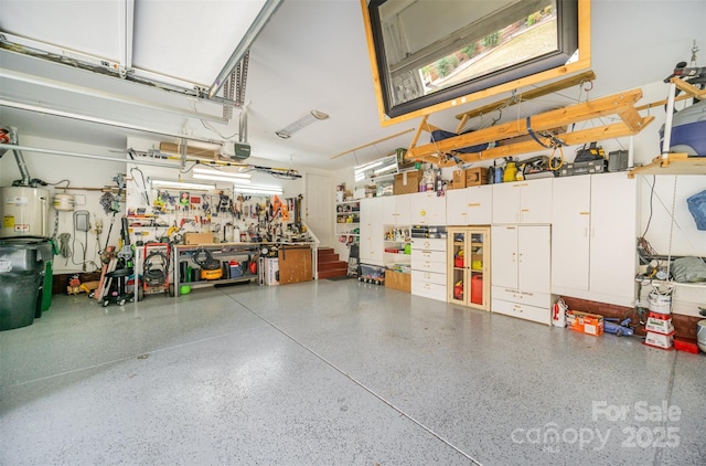 garage featuring a garage door opener and a workshop area