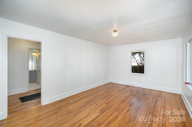 empty room featuring hardwood / wood-style floors