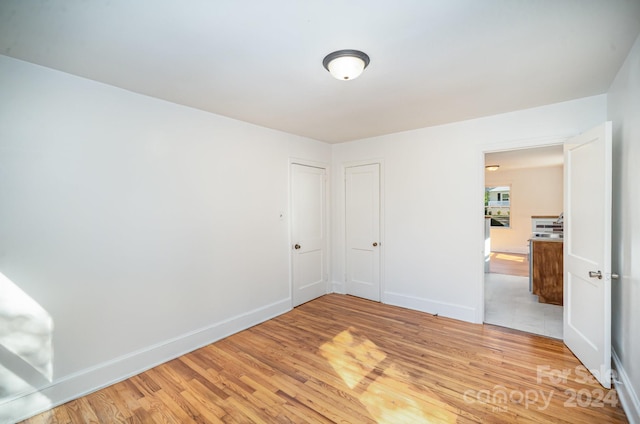 spare room featuring hardwood / wood-style flooring