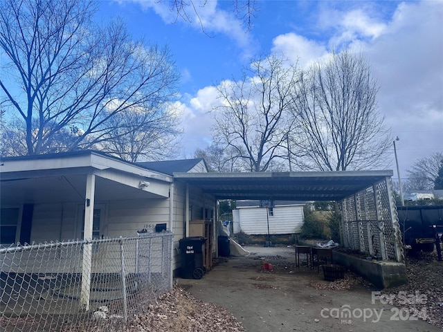 view of property exterior with a carport