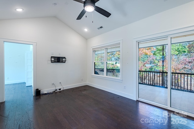 spare room featuring plenty of natural light, dark hardwood / wood-style flooring, and lofted ceiling