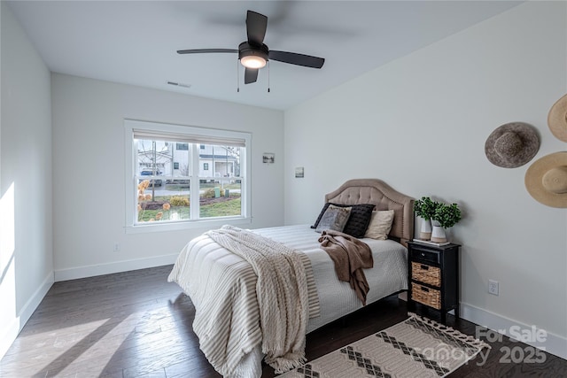 bedroom featuring ceiling fan and dark wood-type flooring