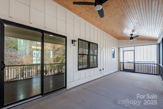 unfurnished sunroom with ceiling fan, wooden ceiling, and lofted ceiling