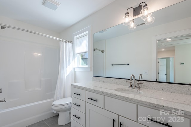 full bathroom featuring toilet, vanity, tile patterned flooring, and shower / bath combo with shower curtain