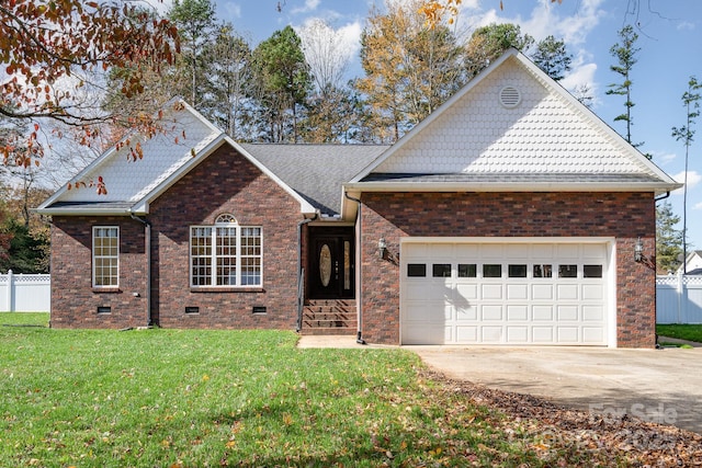 view of front of home with a garage and a front lawn