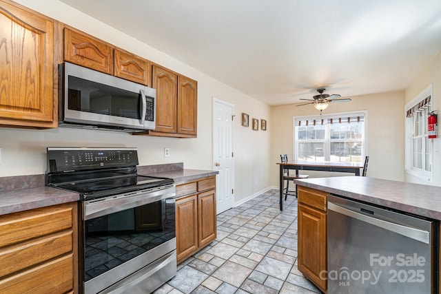 kitchen featuring ceiling fan and appliances with stainless steel finishes