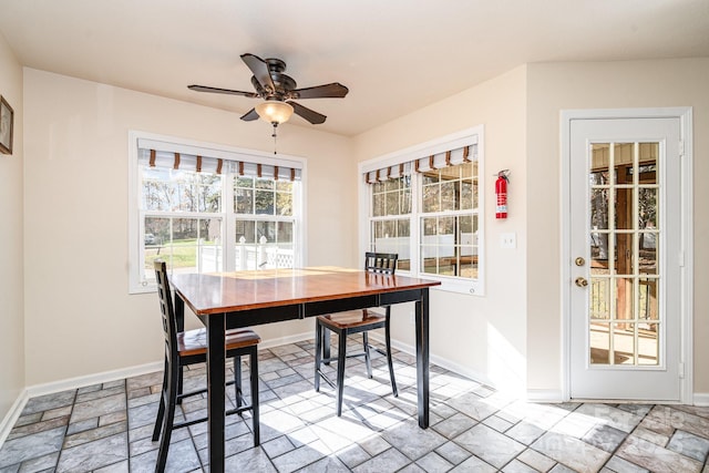 dining space featuring ceiling fan