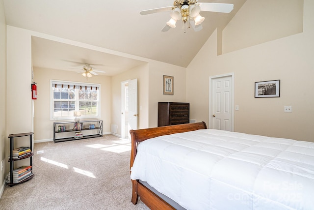 carpeted bedroom featuring high vaulted ceiling and ceiling fan