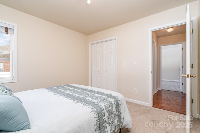 carpeted bedroom with a closet