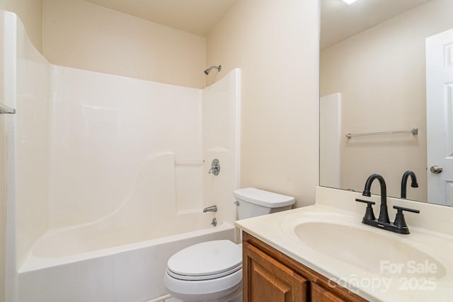 full bathroom featuring shower / bathing tub combination, vanity, and toilet