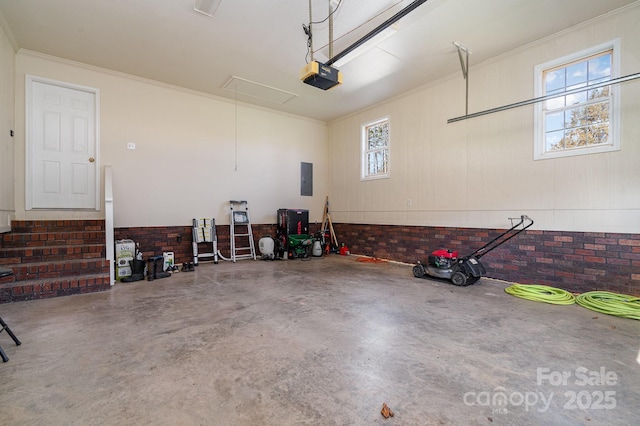 garage with electric panel and a garage door opener