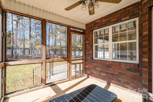 sunroom featuring a wealth of natural light and ceiling fan