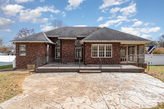 back of property with a patio