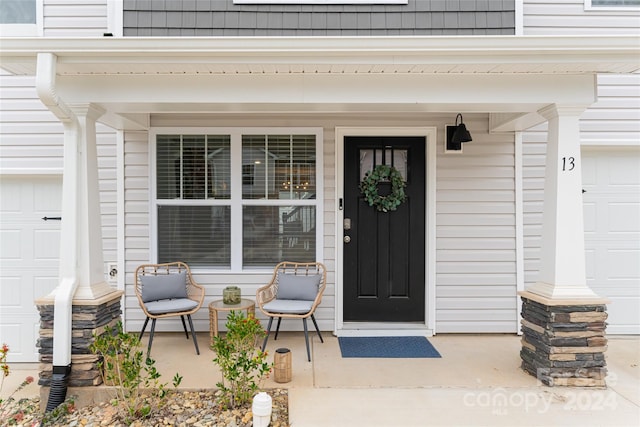 entrance to property featuring a porch